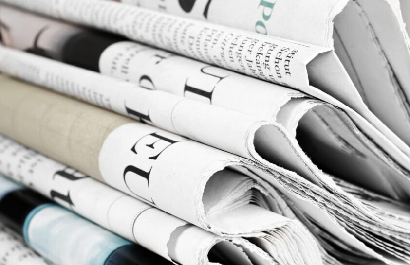Pile of old newspapers, selective focus